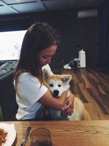 Alexandra Seagal with a akita inu dog